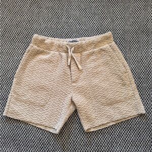 Men’s chubbies, size small cream shorts.